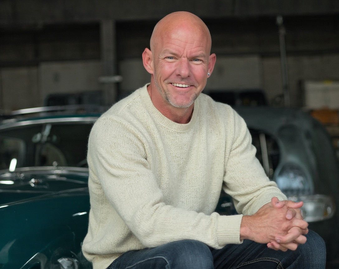 Ken Lundin with a classic car — representing the craft and precision he brings to building revenue systems